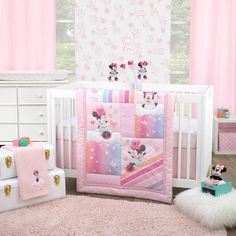 The Disney Minnie Mouse Be Happy 3 Piece Crib Bedding Set includes a comforter, fitted crib sheet and bed skirt. The 33" x 42" comforter features Minnie Mouse in her aqua dress with a sprinkling of hearts and stars! Minnie is sliding down a colorful rainbow of stripes in shades of pink, lavender, aqua and orange. The pink and white fitted crib sheet is a fun all-over Minnie print and is fully elasticized for a safe and snug fit. The adorable solid pink bed skirt has a 10" drop length. Fits a standard size crib/toddler mattress 28" x 52".
Be Happy with the Minnie Mouse 3 Piece Crib Set that includes a comforter, fitted sheet and bed skirt
Featured in bright fun colors of pink, lavender, aqua, and orange with rainbow stripes, hearts and stars
The adorable fitted crib sheet comes with full el Disney Themed Nursery, Mini Crib Bedding, Soft Baby Blankets, Pink Blanket, Nursery Crib, Crib Sets, Mini Crib, Soft Bedding, Crib Bedding Sets