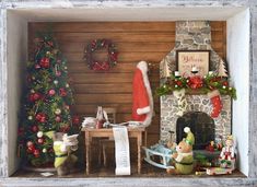 a christmas scene with santa's hat, fireplace and other holiday decorations on display