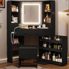 a black vanity with lighted mirror and stool