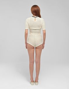 Materials: Knit cottonColors: BeigeDescription: Three-piece knitted set featuring high-waisted micro shorts and removable upper braDetailsShirt: Removable upper bra High neckline Short set-in sleeves Knitted top Cut out bra cups Shorts: High-waisted micro shorts Elastic waistband Knitted shorts Model wearing: SMADE IN ALBANIA BUST WAIST HIPS (cm)XS 84 64 94S 88 68 98M 94 72 102L 102 78 106XL 108 84 110CUSTOM SIZE: We can make any design custom based on your measurements. Customization is offered also about color and some design. Feel free to write us a message. Fitted Sets With Built-in Shorts, High Stretch Crop Top For Summer Loungewear, Seamless Short Length Crop Top For Summer, High Stretch Summer Crop Top For Loungewear, Fitted White Two-piece Top Set, White Fitted Two-piece Tops Set, Seamless Tops For Summer, Seamless Short Tops For Spring, Seamless Short Summer Tops