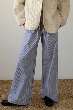 Stay comfortable and stylish with our Pilar Striped Lounge Pants. With a relaxed fit and high waist, these straight leg pants provide both comfort and a flattering silhouette. The elastic waistband and adjustable robe belt ensure the perfect fit for all-day wear. Elevate your loungewear game with these versatile and chic pants. Relaxed Fit Color: White/Blue Stripe Elastic Waistline w/ Adjustable Rope belt High Waist 2 Side Pockets Straight Leg 100% Polyester Striped Lounge Pants, Vintage Lounge, High Waist Wide Leg Pants, Striped Wide Leg Pants, Chic Pants, Pants Fabric, Pants Vintage, Denim Accessories, Jumpsuit Shorts Rompers