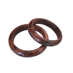 Vintage Pair of 1960's Burled Rosewood Bangles with Silver Inlay India  Condition:  Pre-owned, very good to excellent! Measurements:  Approximately 0.375 inches wide and 8.5 inches inner circumference FREE SHIPPING, US Only Thank you for looking and don't forget to check out my shop for additional fabulous finds~ Traditional Handmade Brown Bangle, Brown Bangle For Formal Occasions, Brown Bangle Jewelry For Formal Occasions, Traditional Brown Bangle Jewelry, Traditional Brown Carved Jewelry, Vintage Hand-tooled Brown Jewelry, Vintage Brown Hand-tooled Jewelry, Brown Carved Bangle Bracelets, Brown Carved Bracelet Jewelry