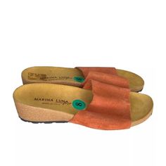 Nwob Marina Luna Women’s Orange Suede And Cork Slip On Sandals 8 Made In Italy *Please Review Photos Prior To Purchase! Size: 8 Heel Height: 2" **Measurements Are Approximate Keywords: Suede, Cork, Slip-On * Note Items From My Store Our Sourced From Various Locations And Most Types Are Sold In The Following Conditions: New, New Without Tags, Liquidation Preowned And Vintage. Items Are Looked Over And We Try To Note Any Flaws. Sometime They May Be Missed Please Reach Out To Me With Any Concerns A Orange Sandals With Cushioned Footbed And Round Toe, Beach Mules With Ortholite Insole And Round Toe, Casual Heels With Ortholite Insole And Open Heel, Orange Open Toe Sandals With Textured Footbed, Synthetic Mules With Ortholite Insole, Casual Orange Closed Toe Mules, Orange Sandals With Heel Loop And Round Toe, Casual Suede Wedge Sandals With Round Toe, Casual Slip-on Footbed Sandals With Heel Loop