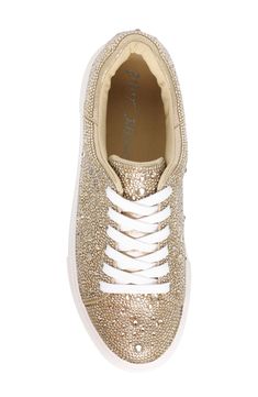 A symphony of glimmering crystals amplify a casual low top sneaker, while a hearty bumper-trimmed platform complete this strut-worty style. 1" platform Lace-up vamp closure Rhinestone and textile upper/textile lining/rubber sole Imported Gold Embellished Lace-up Sneakers, Embellished Synthetic Low-top Sneakers, Embellished Low-top Synthetic Sneakers, Sporty Embellished Low-top Sneakers, Sporty Low-top Embellished Sneakers, Gold Embellished Sneakers With Round Toe, Sparkling Low-top Sporty Sneakers, Sporty Sparkling Low-top Sneakers, Sporty Low-top Sparkling Sneakers