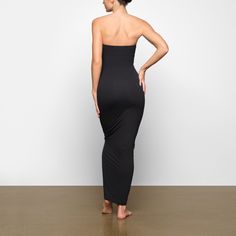 This buttery-soft and stretchy strapless maxi dress will become your go-to for all your plans, double-lined with Fits Everybody fabric for a flattering, body-hugging fit. Fits true to size. | SKIMS Tube Dress | Black | Large | Fits Everybody Solid Seamless Maxi Dress, Fitted Seamless Maxi Dress, Seamless Fitted Maxi Dress, Solid Strapless Smoothing Tube Top, Strapless Solid Tube Top With Smoothing, Fitted Seamless Maxi Dress For Night Out, Solid Smoothing Strapless Tube Top, Strapless Smoothing Tube Top, Fitted Bandeau Shapewear