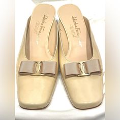 Never Worn Salvatore Ferragamo Tan / Cream Gold Bow Accent Leather High Heels Size 9b These Are In New, Never Used Condition. Any Flaws On Shoes Are A Direct Sign Of Aging And/Or Storage, Not Wear!! All Items Are From A Private, Luxury Collection. Genuine Leather - These Are An Elevated Basic That Will Last For Years To Come And Are A Perfect Pairing With Any Outfit! Features A Pointed Toe With Rounded Design For Comfort And Style - Very Unique And Chic!! Heel Height (Approx.) : 2” Made In Italy Designer Office Heels For Spring, Designer Spring Office Heels, Classic Spring Calf Leather Heels, Designer Beige Heels For Formal Occasions, Spring Cream Calf Leather Heels, Cream Calf Leather Heels For Spring, Beige Heels With Leather Lining, Formal Beige Heels With Leather Sole, Cream Square Toe Heels For Formal Occasions