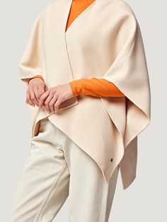 Elegant Beige Cape Poncho, Beige Cashmere Outerwear For Spring, Elegant Beige Poncho, Cream Cashmere Outerwear For Spring, Cream Wool Outerwear For Layering, Cream Cashmere Spring Outerwear, Spring Cream Cashmere Outerwear, Elegant Beige Poncho For Fall, Elegant Wool Shawl Outerwear