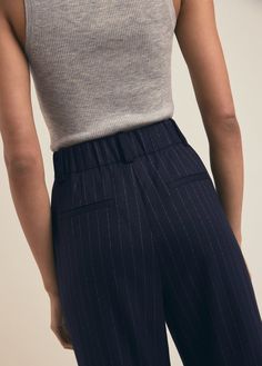 Our dreamy rendition of everyone's favorite trouser offers the same best-selling styling--front pleats, a fluid wide leg hem, and front pockets. The Dream Favorite Pant also features an elastic back waistband for a super comfortable, relaxed fit. Crafted from a classic pinstripe with stretch for added comfort, these easy-care trousers may be your favorite ones yet.65% Polyester, 33% Rayon, 2% Spandex Lameka is 5'9.5" wearing size 2. Navy Pinstripe Pants Outfit, Pinstripe Wide-leg Pants For Workwear, Pinstripe Bottoms With Pockets Relaxed Fit, Pinstripe Wide-leg Workwear Pants, Pinstripe Pants Outfit, Casual Pinstripe Wide-leg Bottoms, Pinstripe Wide-leg Bottoms With Relaxed Fit, Striped Wide Leg Trousers, Pants Outfit Work