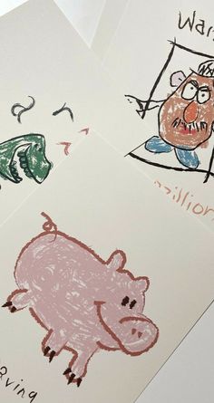 three children's drawings are shown on paper