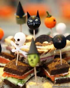 an assortment of halloween treats with black cats on them