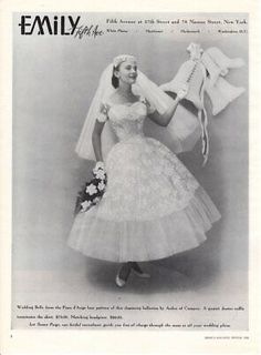 an old photo of a woman wearing a wedding dress and holding a large white pillow