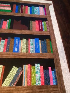 a book shelf filled with lots of colorful books