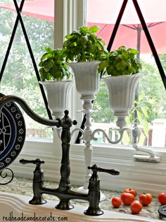 a kitchen window sill with an old fashioned clock hanging from it's side