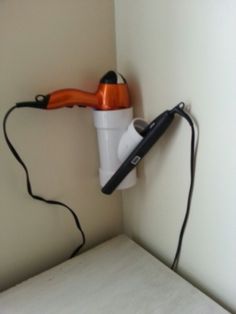 an electric hair dryer is plugged into the wall