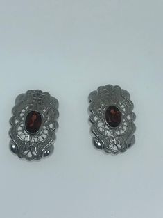 Vintage earrings Main stone Bohemian Garnet Lovely handmade silver work About an inch 92.5% Sterling Silver All jewelry is shipped in a nice gift box. Check out our over a THOUSAND great reviews Traditional Sterling Silver Clip-on Earrings, Ornate Silver Clip-on Earrings For Formal Occasions, Antique Silver Clip-on Earrings For Anniversary, Silver Clip-on Earrings For Jewelry Making, Unique Silver Clip-on Earrings, Handmade Classic Silver Clip-on Earrings, Silver Handmade Classic Clip-on Earrings, Traditional 925 Stamped Silver Earrings For Formal Occasions, Handmade Silver Clip-on Classic Earrings