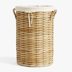 a large wicker basket with white lining