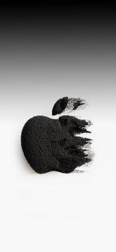 an apple logo made out of black powder