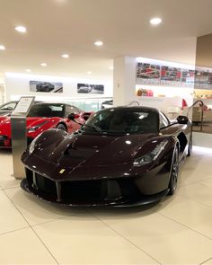 a car showroom filled with different types of cars