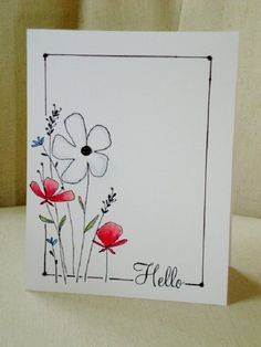 a white card with red flowers and the word hello written in black ink on it