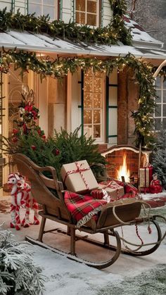 a sleigh with presents on it in front of a house