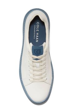 This sleek leather sneaker with clean lines inspired by classic tennis styles has rubber caps on the toe and heel for added traction. Soft and flexible, this low-top silhouette is outfitted with signature GrandOS technology for comfort without compromise. Lace-up style Removable insole Leather upper/textile lining/rubber sole Imported Men's Shoes Functional Round Toe Tennis Sneakers, Sporty White Golf Shoes With Rubber Sole, Classic Tennis Sneakers With Cushioned Footbed, Sporty Sneakers With Rubber Toe Cap, Casual Golf Shoes With Rubber Sole For Light Sports, White Tennis Sneakers With Contrast Sole, Classic Cushioned Tennis Sneakers, Modern Leather Tennis Sneakers, Tennis Sneakers With Cushioned Footbed And White Sole