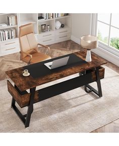 a desk with a laptop on it in front of a chair and bookshelf