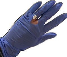 a blue glove with a diamond ring on it