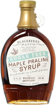 a bottle of maple syrup on a white background