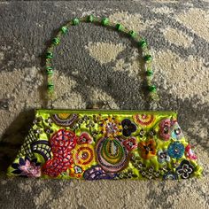 Beautiful Little Hand Purse, Embroidered, Rhinestones And Beaded Flowers. Unique Hard To Find In Perfect Condition 4"'X Deep By 8 1/2" At Top 10" At Bottom Opening Is 5" X 8 1/2". '... 21" Beaded Strap! Little Pocket Inside 4" X 2 3/4" Questions? Leave A Comment Below! Colorful Clutch, Flowers Unique, Hand Purse, Beaded Strap, Clutch Purse, Beaded Flowers, Inside Pocket, Top 10, Bag Lady