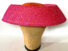 Perfect for Easter this lovely wide brim hat is woven straw in bright pink and orange. Measures 13.6"W x 3.5"H. Elastic strap holds in place. Orange Adjustable Brimmed Straw Hat, Orange Brimmed Straw Hat With Adjustable Fit, Adjustable Brimmed Orange Straw Hat, Pink Wide Brim Straw Hat, Pink Straw Hat With Short Brim, Orange Wide Brim Straw Hat For Spring, Pink Wide Brim Straw Sun Hat, Orange Straw Hat With Curved Brim For Spring, Orange Curved Brim Straw Hat For Spring