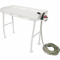 a white table with a hose attached to it