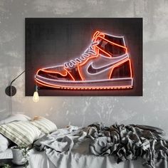 a neon nike shoe is on display in a room with a bed and lamp next to it