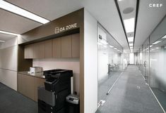 an empty office with lots of cabinets and trash cans