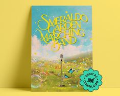 a book with an image of a garden and a microphone on the cover that reads, emerald garden marching band