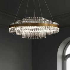 a chandelier hanging from the ceiling in a dark room