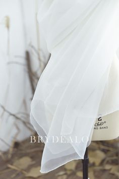 Elevate your creations with our high-quality polyester organza. Its crisp hand and beautiful sheerness make it perfect for special occasion dresses, voluminous skirts, overlays, costumes, and decorations. Also ideal for home decor like sheer curtains. shown color: white content: nylon sold: by the yard weight: light weight elasticity: no width: 150 cm swatches: available washing instructions: hand wash/drip dry