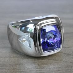 a ring with a blue stone in the center