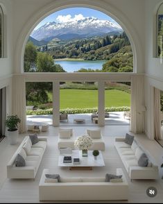 a living room filled with furniture and a large window