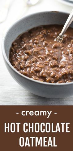 creamy hot chocolate oatmeal in a pan with a spoon on the side