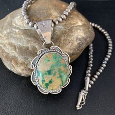 Masha Indian Native American Jewelry   -On Route 66 -         Albuquerque, New Mexico U.S.A     Item Specifics            Stone : Royston Turquoise Size : 20" Pendant Size : 1.75" x 3" Bead Size : 5mm Color : Green Artisan : Gilbert Nez SKU : 14005 Genuine Sterling Silver Jewelry  This beautiful Necklace is made from all 925 Sterling Silver Beads and Findings.  These Beads are meticulously hand strung and assembled by the artist creating the perfect balance of fall, color and shine. Necklaces are a must have for any collection, whether you are just starting out or are a serious collector you will not be disappointed with this work of art. These necklaces have excellent fall and can even be stacked with others, fashioned with a pendant or worn double wrapped to give you different look every Navajo Pearls, Albuquerque New Mexico, Royston Turquoise, Southwestern Jewelry, Fall Color, Turquoise Pendant, American Jewelry, Native American Jewelry, Beautiful Necklace