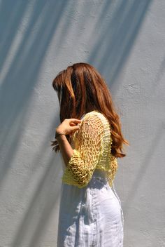 Sweet and simple little yellow shrug for summer days when all you need is a light weight cover-up to cover shoulders and upper arms. I hand knit this item with a cotton viscose ethically sourced yarn. It is very soft and comfortable. The open-net/loose-knit style will keep you cool but still giving you the coverage you need. Hand knitted shrug Sleeve length: Half sleeve, reaches half way between elbows and wrist. Color: Soft Yellow Ecru/Ivory Taupe/beige with specks of yellow Size: Small, Medium Stretch Open Knit Cover-up For Spring, Open Knit Summer Shrug For Beach, Open Knit Shrug For Summer Beach, Spring Open Knit Stretch Shrug, Summer Beach Open Knit Shrug, Stretch Open Knit Shrug For Spring, Spring Open Knit Cover-up In One Size, Spring Open Knit One-size Cover-up, Long Sleeve Crochet Shrug For Summer