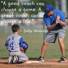 a man kneeling down next to a little boy on a baseball field