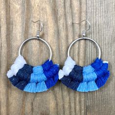 This pair of beautiful macrame earrings were hand knotted and fringed at the edges with shades of blue colored cotton cord. These are surprisingly lightweight to wear and have nickel free antique silver earring wires. Each round shaped earring is 1 1/2 inches long and about 1 inch wide.  Made with love in a smoke-free home! If you have a sensitivity to certain types of metal, make sure to check each listing to see what types of earring wires were used.  Be sure to check out the rest of my micro-macrame jewelry in the shop! Earrings https://www.etsy.com/shop/HKMacrameJewelry?ref=hdr_shop_menu§ion_id=19344454 Bracelets https://www.etsy.com/shop/HKMacrameJewelry?ref=hdr_shop_menu§ion_id=8158880 Cuff Bracelets https://www.etsy.com/shop/HKMacrameJewelry?ref=hdr_shop_menu§ion_id=19122959 Hemp Je Blue Macrame Dangle Earrings, Blue Dangle Earrings With Macrame, Adjustable Handwoven Blue Earrings, Bohemian Blue Macrame Earrings, Blue Bohemian Macrame Earrings, Blue Macrame Bohemian Earrings, Types Of Earring, Knotted Fringe, Antique Silver Earrings