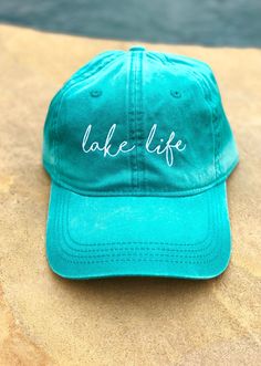 Great for a day in the sun or a day out on the lake! HAT INFORMATION: -Embroidered -6 Panel -Enzyme Washed -Heavy Construction Stitch on Crown and Visor -Pigment Dyed Cotton Twill -Pre-Curved Visor -Tuck Strap with Slide Closure -Unstructured ALL SALES FINAL! All orders within US will ship via USPS first class with tracking to arrive within 5-8 business days depending on your location. Spring Vacation Cotton Baseball Cap, Green Baseball Cap With Embroidered Logo For Summer, Spring Outdoor Hat With Embroidered Logo, Beach Green Cotton Baseball Cap, Green Cotton Baseball Cap For Beach, Summer Embroidered Green Hat, Green Embroidered Summer Hat, Embroidered Hat, Embroidered Hats