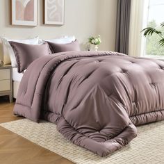 the comforter is made up and ready for someone to use it in their bed