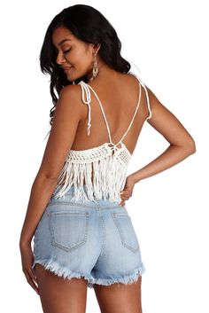 Keep it festive in this adorable fringe halter top! It features a sleeveless bodice. halter straps that lead to a back tie closure. a deep V neckline. a sheer inset underneath the bust. and fringe detailing that flows down. The top is composed of a crochet fabric with moderate stretch.Model is 5'8" with a 32" bust. 23" waist and 36" hips. She is wearing a size small. Fringe Halter Top, Crochet Fabric, Festival Tops, Sweater Shop, Deep V, Halter Top, Camisole Top, Bodice, White And Black