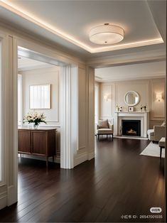 a living room with hard wood floors and white walls on either side of the fireplace