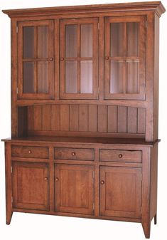 a wooden china cabinet with glass doors on the top and bottom, against a white background