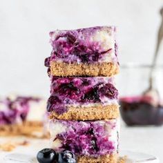 blueberry cheesecake bars stacked on top of each other