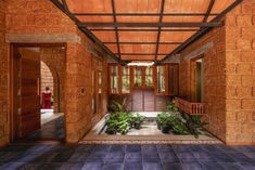 an entry way with plants and potted plants